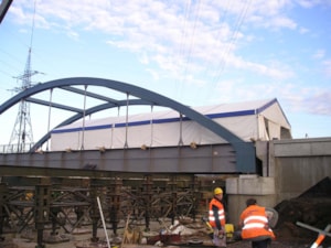 Temporary roofing for assembly – cover over the site, workers present