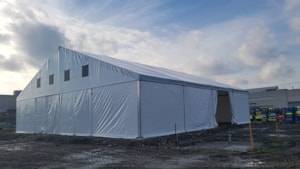 Long temporary hall on site – side view, open access