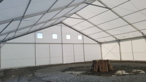 Interior of a temporary hall – gable with windows, clear-span frame