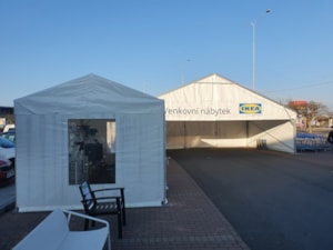 Fabric tent hall extending the store – sales zone with a smaller shelter next to it