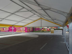 Fabric tent hall interior – covered shopping area with advertising panels along the sides