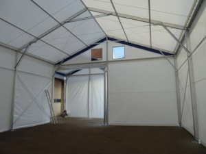 Fabric hall extension interior – gable area with a passage and small windows