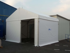 Smaller tent hall extension – front view, covered entrance next to a building