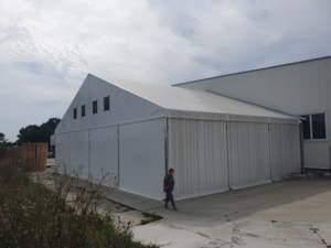 Tent hall extension to a building – long storage expansion (side view)