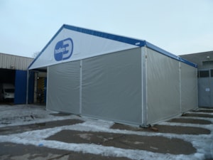 Tent hall extension – front view with gable branding (winter operation)