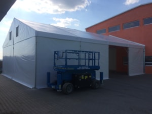 Tent hall extension – installation next to a building, equipment at the open entrance
