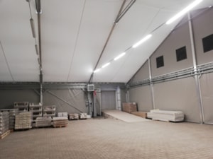 Insulated fabric hall with a spacious interior for storage and service