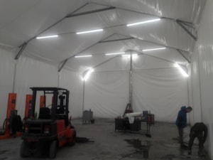Insulated fabric hall with handling equipment and a working area