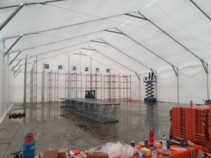 Insulated fabric hall with inner lining and installed storage equipment