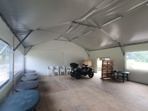 Insulated tent hall with interior space for service, facilities and equipment