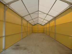 Fabric agricultural hall with a long interior space for storing feed and materials
