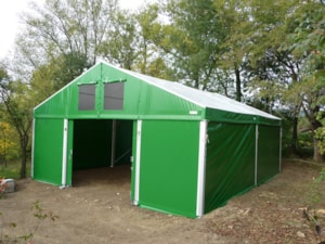 Agricultural tent hall with a front entrance and side opening